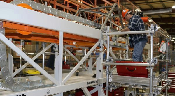 A worker trains on a Powertrack mock-up at the Darlington Energy Centre.