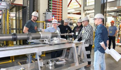 Lorraine Chipman, centre, instructs other millwrights at the full-scale reactor mock-up.