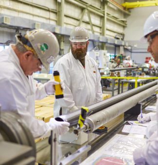 Workers assemble fuel channels for Darlington's Unit 2.