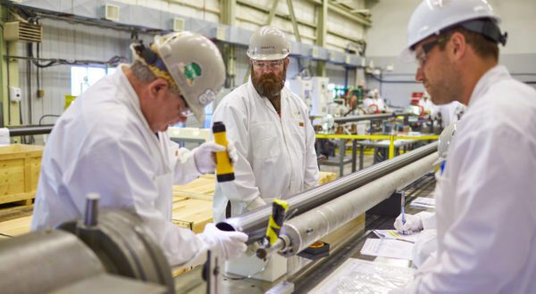 Workers assemble fuel channels for Darlington's Unit 2.