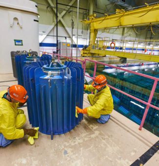 Workers at Pickering Nuclear GS prepare Cobalt-60 isotopes for delivery to Nordion.