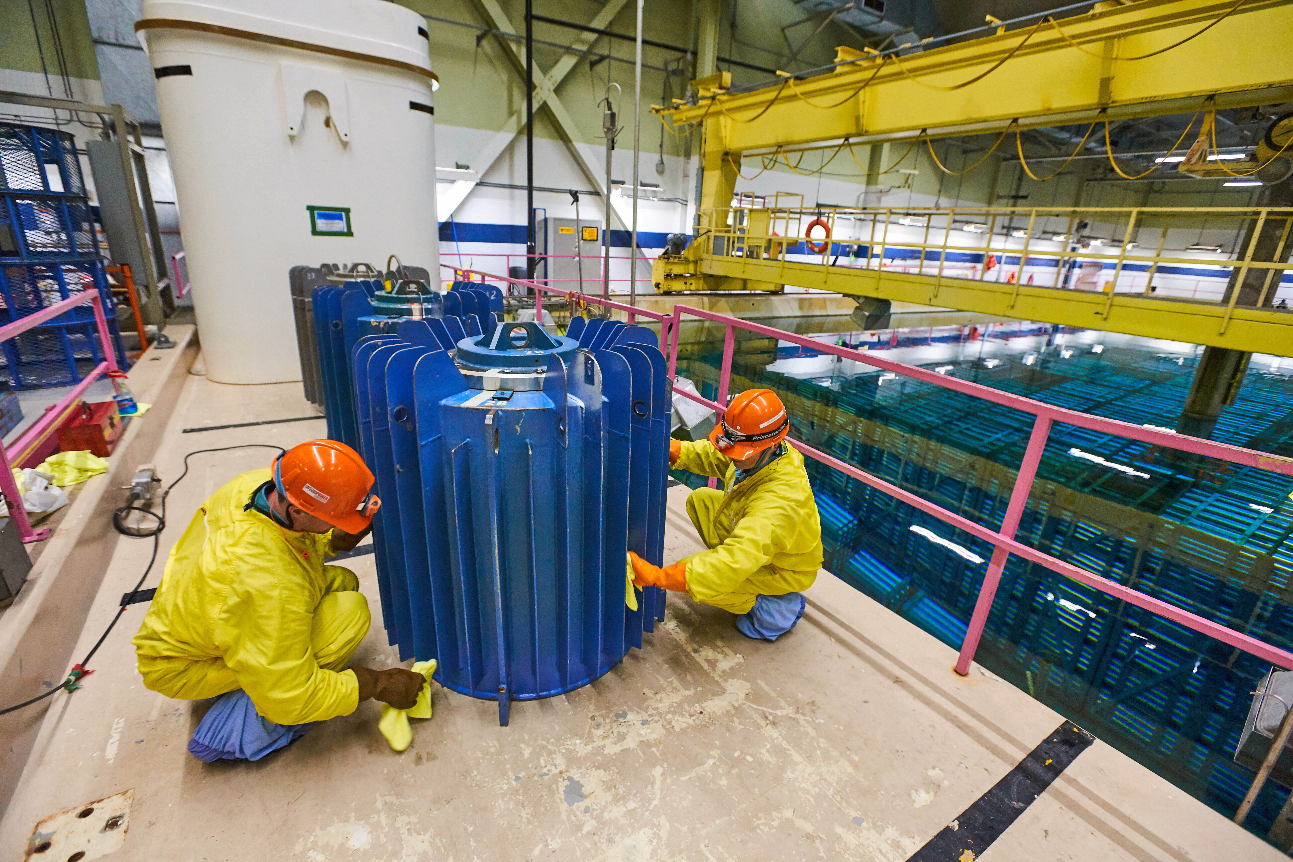 Workers at Pickering Nuclear GS prepare Cobalt-60 isotopes for delivery to Nordion.