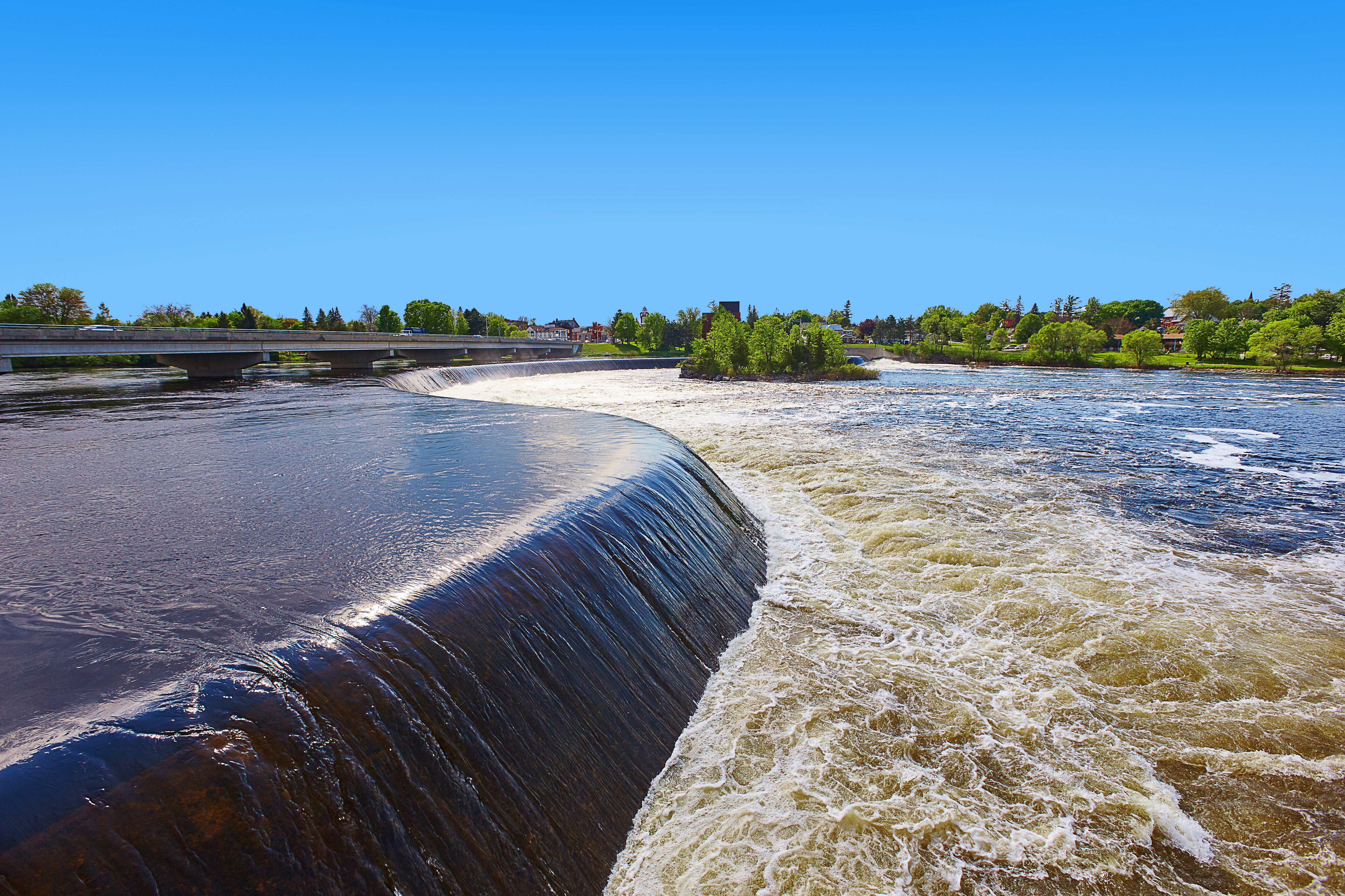 Water pours over the Arnprior Weir.