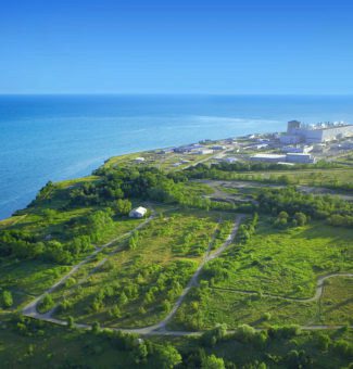 An aerial view of Darlington Nuclear Generating Station from afar.