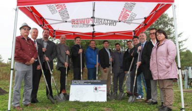 OPG and Mohawk Council of Akwesasne representatives stand together with shovels.