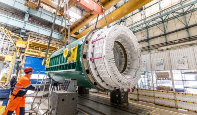 Workers at a GE plant in Poland prepare a massive generator stator for shipment to Darlington Nuclear.