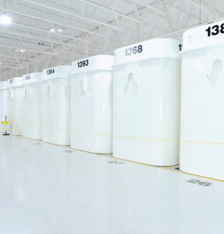 Dry storage containers at a spotlessly-clean nuclear waste storage facility.