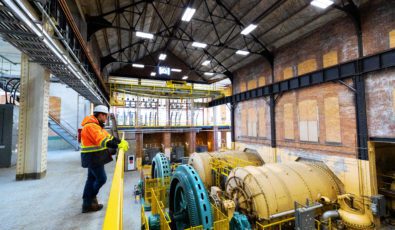 Workers look down on turbines undergoing maintenance at Ranney Falls hydroelectric station.