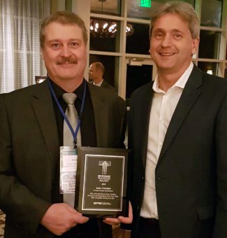 OPG employee Alex Crichton, left, received the Technology Transfer Award from EPRI