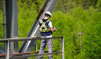 An operator controls a drone during an inspection at the Abitibi Canyon hydroelectric station.