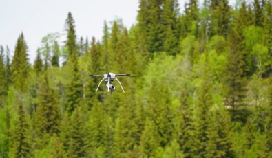 A drone flies through the air during an inspection at OPG's Abitibi Canyon GS.