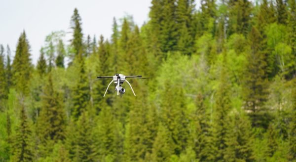 A drone flies through the air during an inspection at OPG's Abitibi Canyon GS.