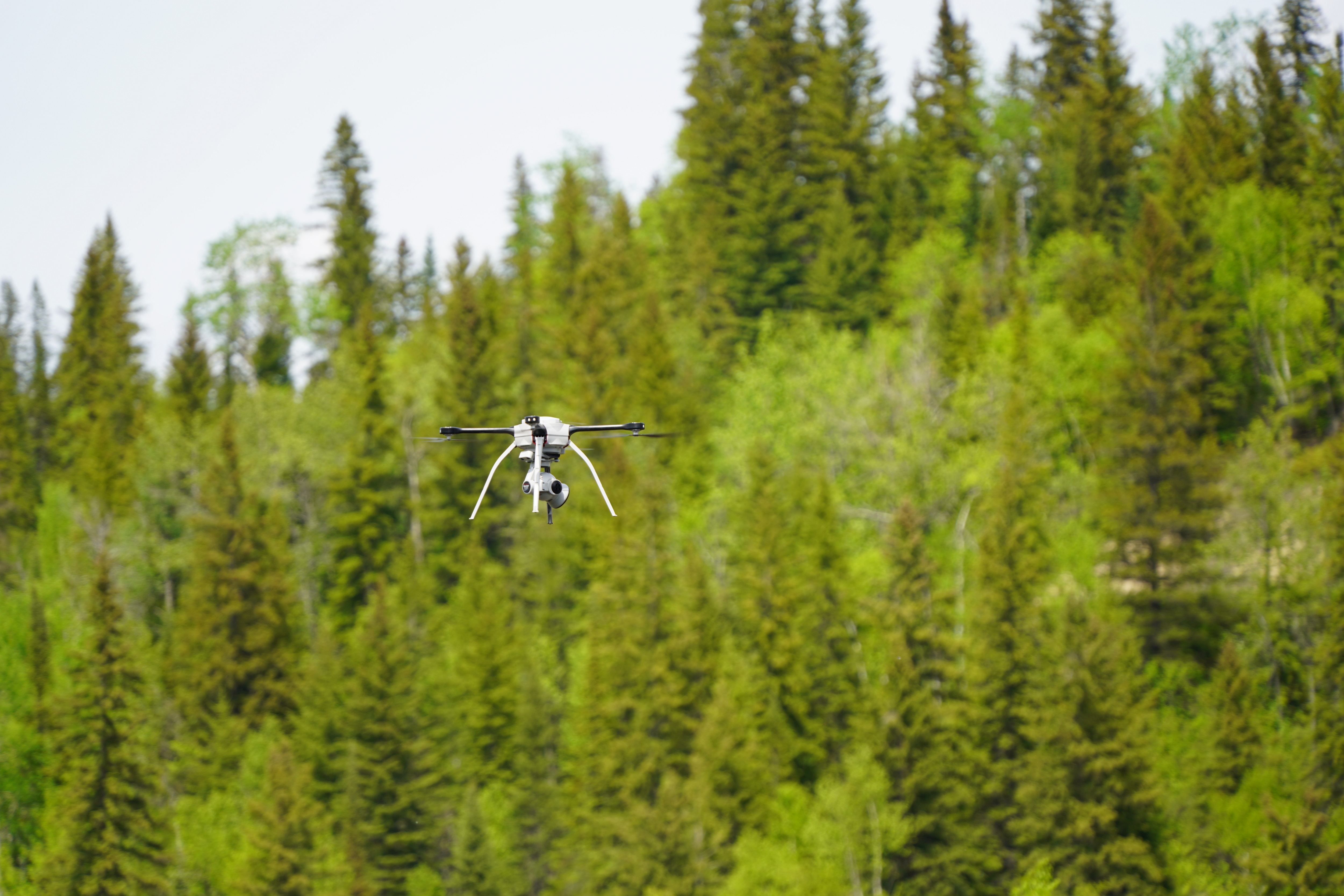 A drone flies through the air during an inspection at OPG's Abitibi Canyon GS.