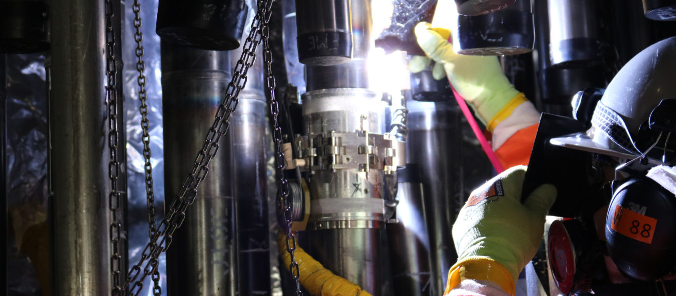 A welder on the Darlington Refurbishment project welds a lower feeder to a middle feeder during the assembly of one of 960 feeder tubes on the Darlington Unit 2 reactor.