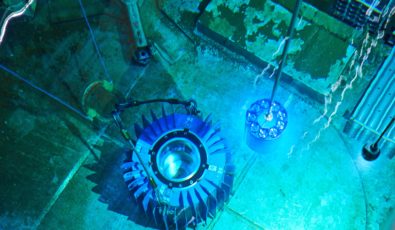 Cobalt-60 isotopes are placed into a flask in the spent fuel bay at Pickering Nuclear GS.