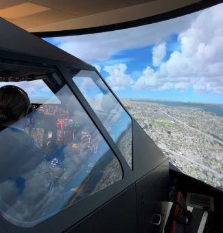 A student from the Clarington 172 Royal Canadian Air Cadets takes to the skies in a Boeing 737 flight simulator at Darlington Nuclear.