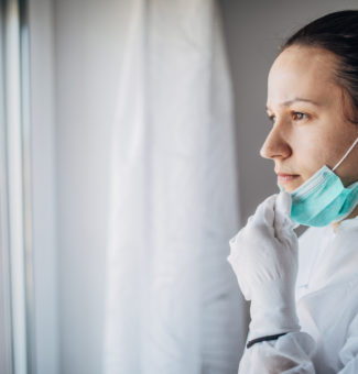 A doctor in a protective suit