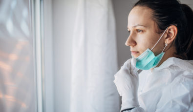 A doctor in a protective suit