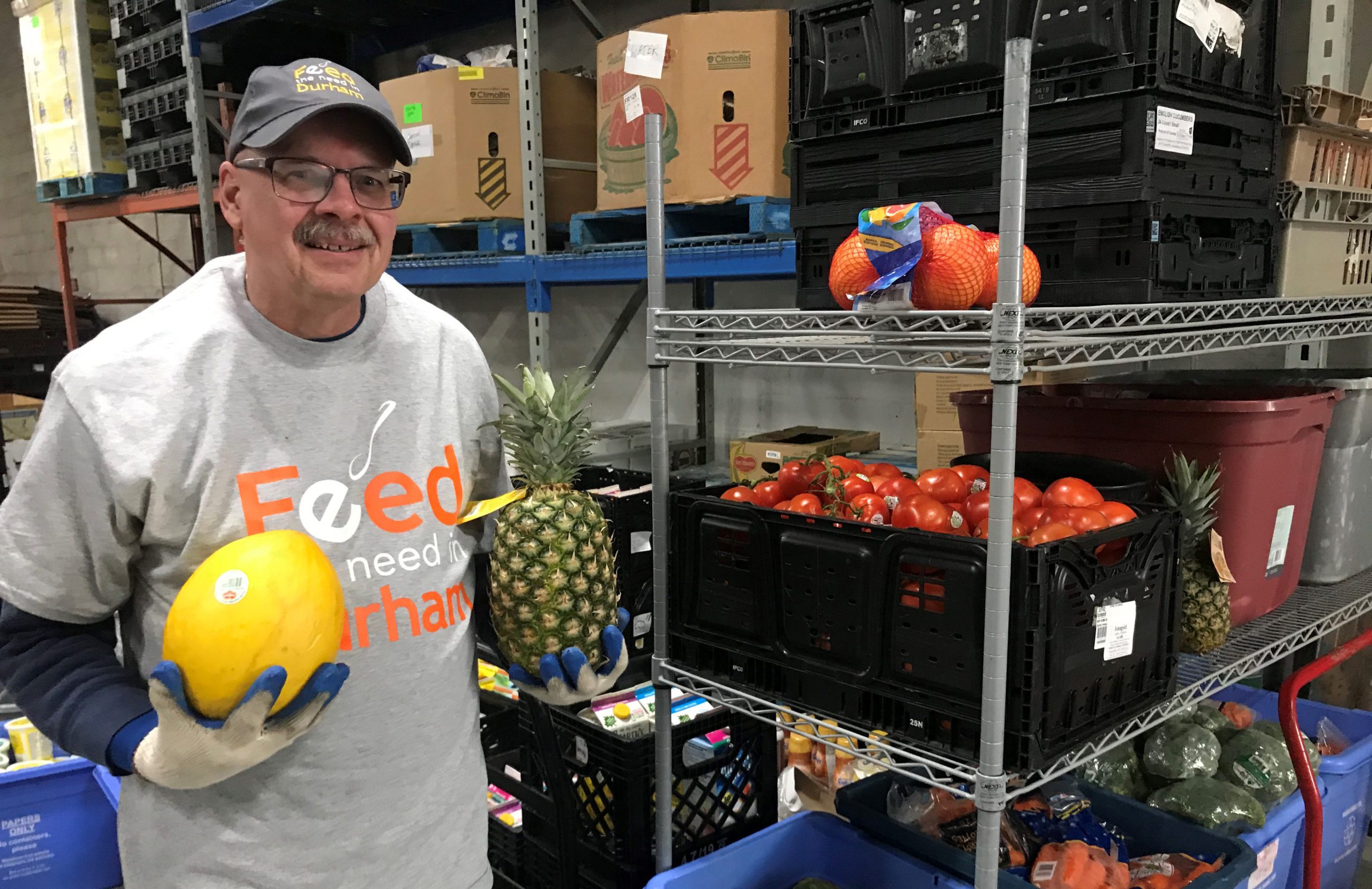 A worker with Feed the Need Durham setting up food deliveries.