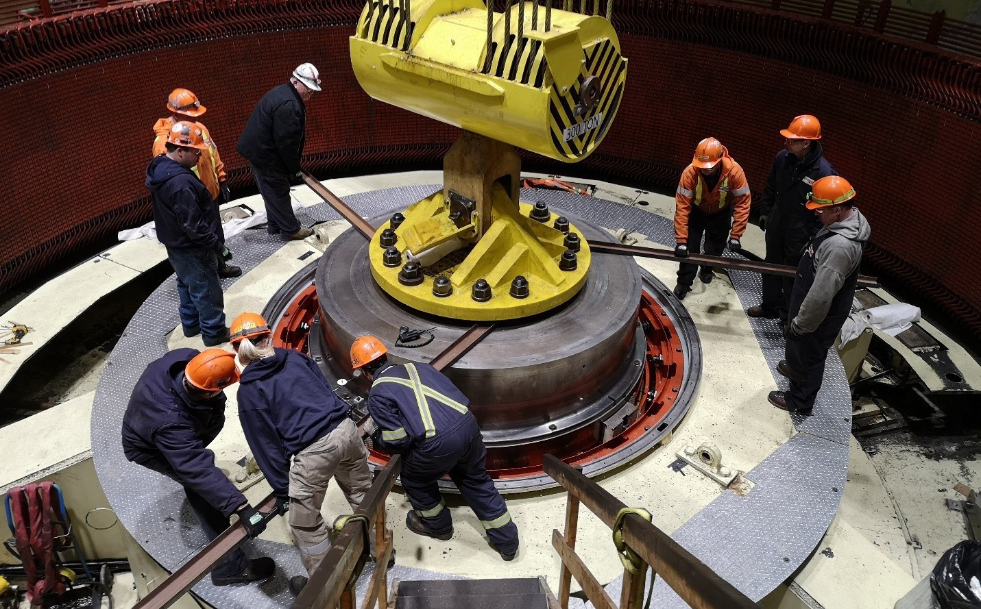 The outage crew at R.H. Saunders GS manually rotate the generator shaft of the station's G7 unit.