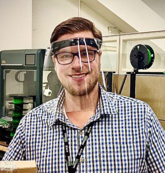 An employee wearing a 3D printed face shield.