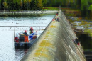 Workers in safety gear on Waboose dam