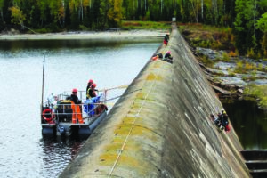 Workers in safety gear on Waboose dam