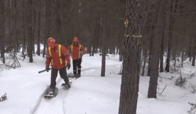 OPG's Alain Ratthe and partner Ed Smart head into the bush in snow shoes to conduct a snow survey.