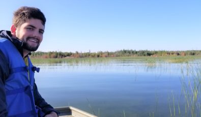 OPG's Adam Melick, an Assistant Environmental Advisor, surveys the wetland area of the Bruce nuclear site.