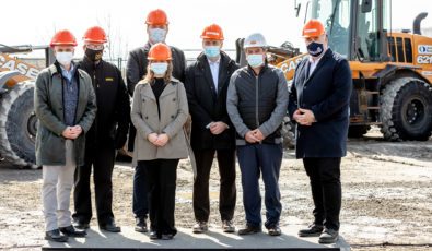 Representatives from OPG, the Province, E.S. Fox, and Durham Region stand where early site preparation work will soon begin on the Darlington New Nuclear Project.