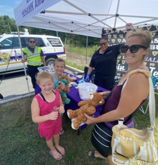 Families enjoy a teddy bear picnic at the Saunders visitor centre with the help of Akwesasne Mohawk Ambulance.