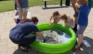 Visitors take part in a River Institute workshop on invertebrate sampling.