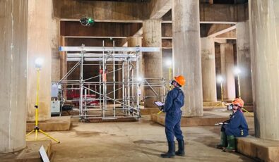 OPG employees control a drone to inspect Pickering Nuclear's vacuum building.