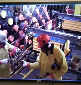 Works loading nuclear fuel into the Darlington Unit 3 reactor.