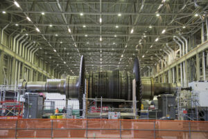 DNGS Low Pressure Turbine spindle removed and placed on a stand