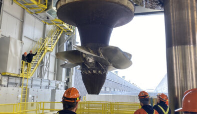 The massive turbine runner is pulled up from R.H. Saunders GS's Unit 9, which is undergoing an overhaul.