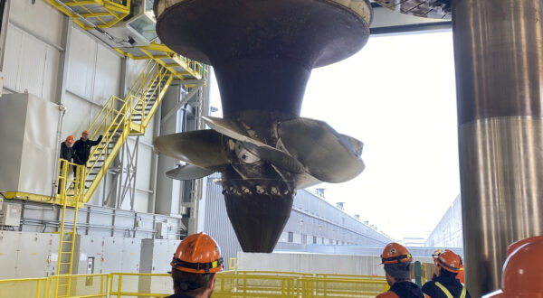 The massive turbine runner is pulled up from R.H. Saunders GS's Unit 9, which is undergoing an overhaul.