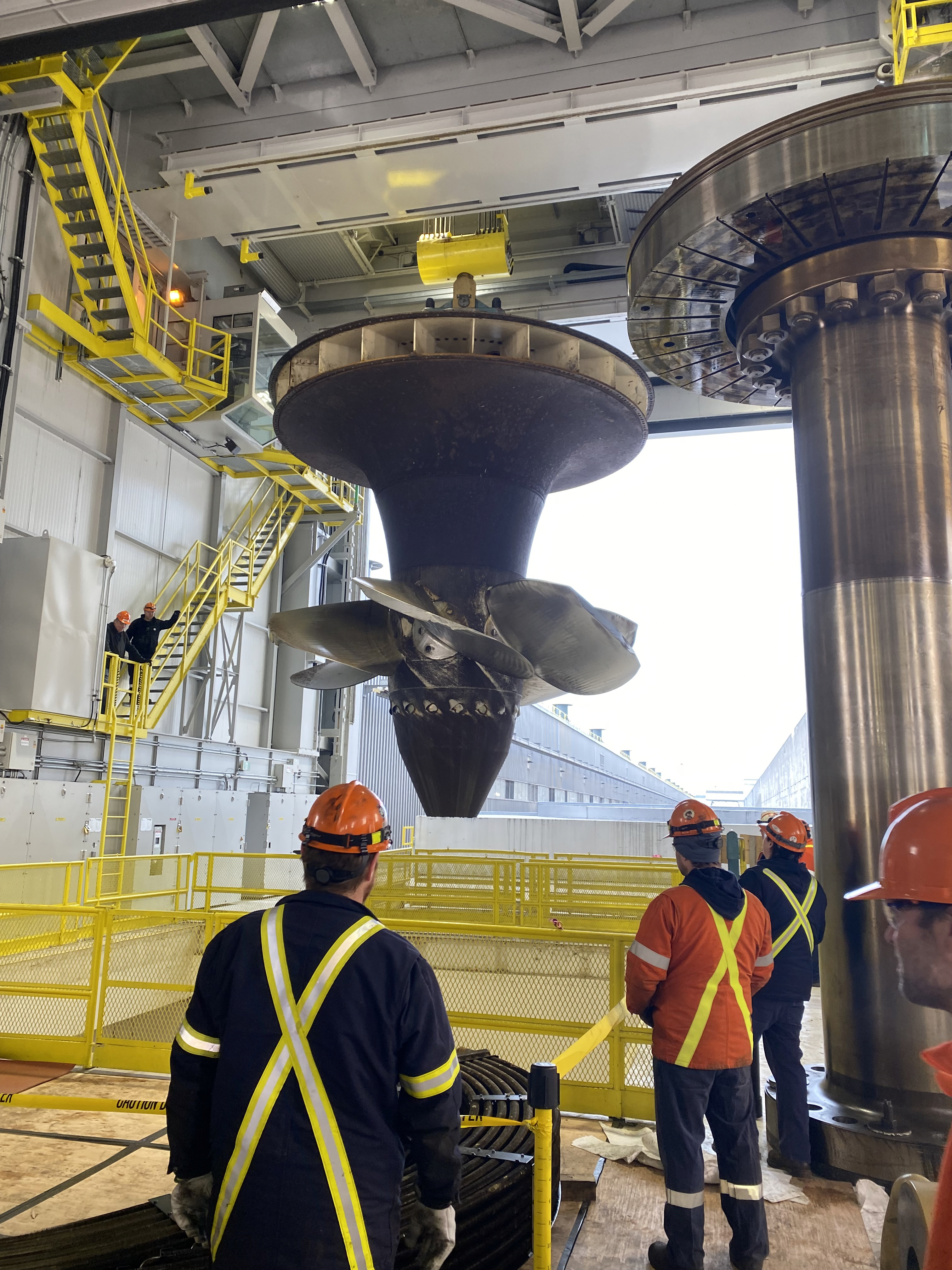 The massive turbine runner is pulled up from R.H. Saunders GS's Unit 9, which is undergoing an overhaul.