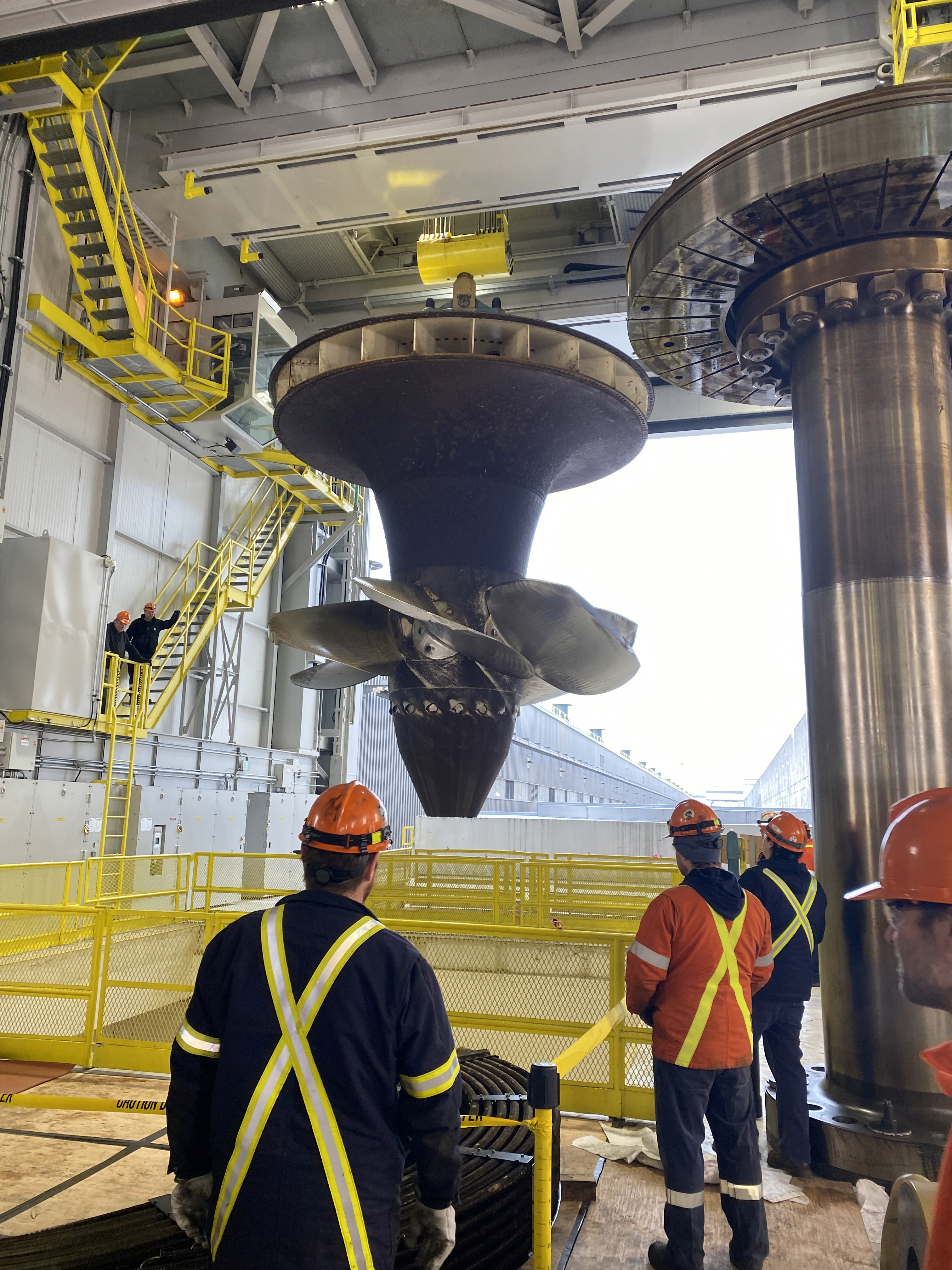 The massive turbine runner is pulled up from R.H. Saunders GS's G9 unit, the first of the station's 16 units to be refurbished.