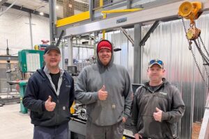 Millwright apprentice Lawrence Wesley, centre, poses with OPG employees David Birtch, Mechanical Technician, left, and Dave Edge, Service Trades Maintainer, right, at OPG's North Bay Work Centre.