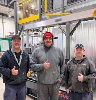 Millwright apprentice Lawrence Wesley, centre, poses with OPG employees David Birtch, Mechanical Technician, left, and Dave Edge, Service Trades Maintainer, right, at OPG's North Bay Work Centre.