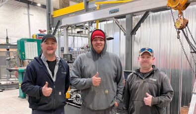 Millwright apprentice Lawrence Wesley, centre, poses with OPG employees David Birtch, Mechanical Technician, left, and Dave Edge, Service Trades Maintainer, right, at OPG's North Bay Work Centre.