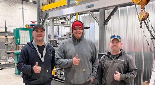 Millwright apprentice Lawrence Wesley, centre, poses with OPG employees David Birtch, Mechanical Technician, left, and Dave Edge, Service Trades Maintainer, right, at OPG's North Bay Work Centre.