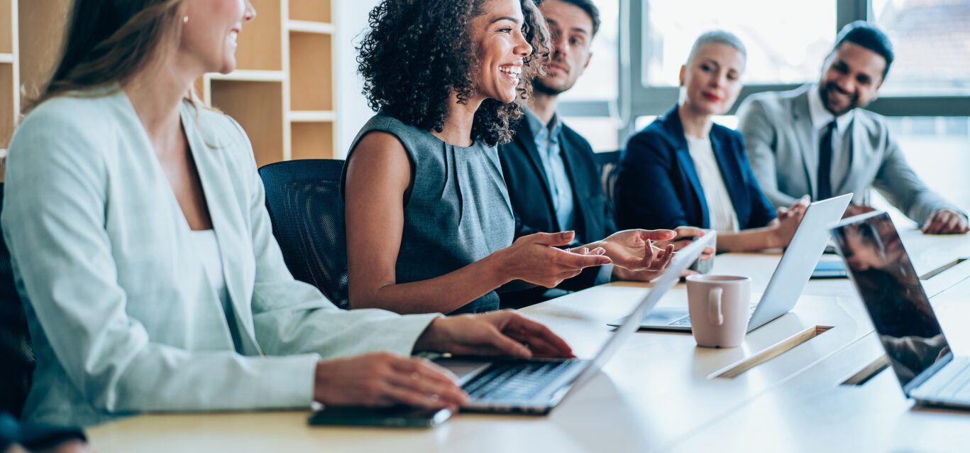 Group of business persons in business meeting. Group of entrepreneurs on meeting in board room. Corporate business team on meeting in the office.