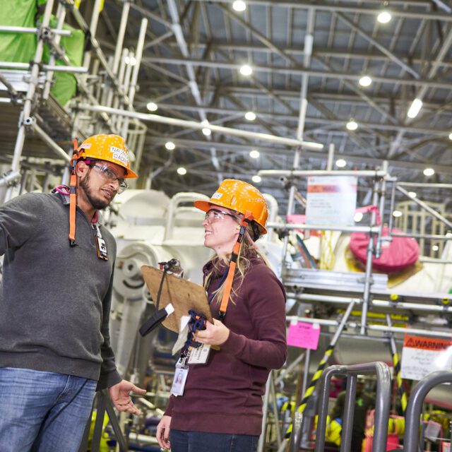 Diverse employees on the turbine floor