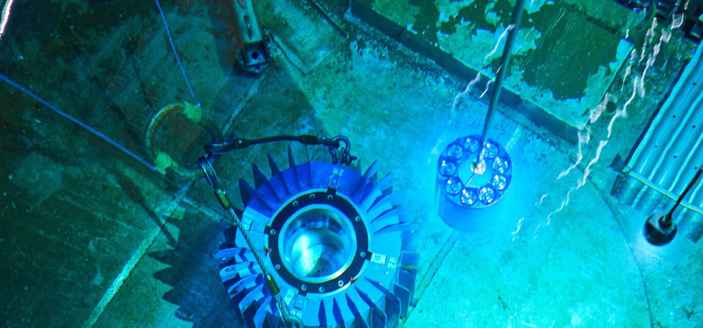 Cobalt-60 isotopes are placed into a flask in the spent fuel bay at Pickering Nuclear GS.