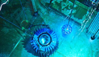 Cobalt-60 isotopes are placed into a flask in the spent fuel bay at Pickering Nuclear GS.