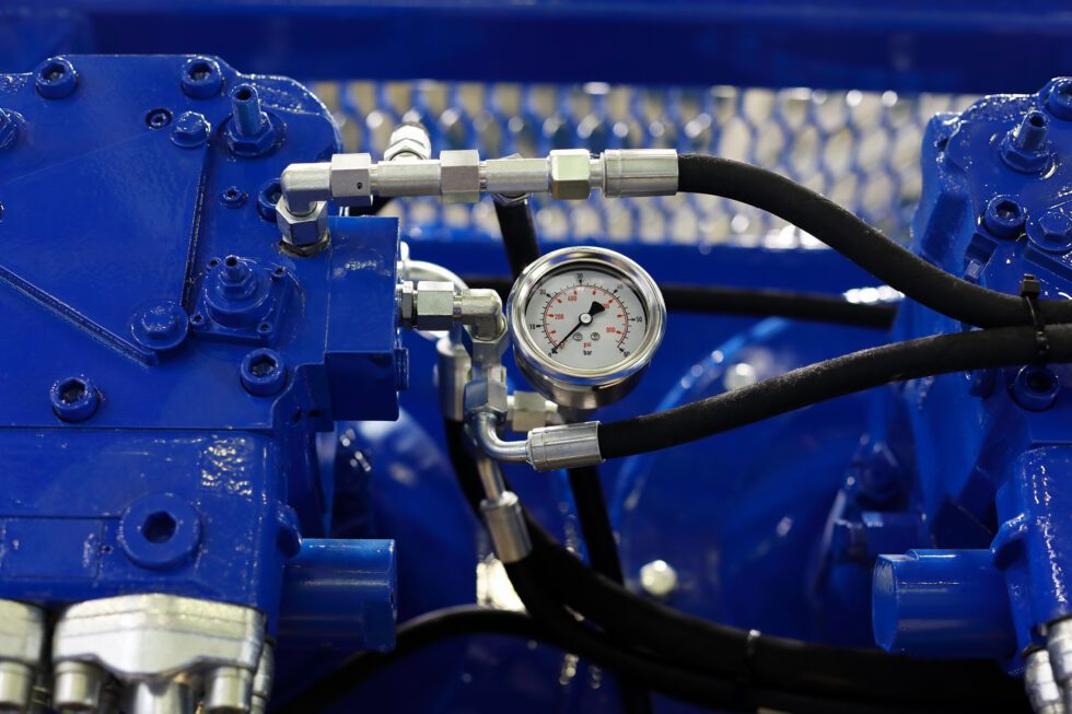 Close up view of air compressor with pressure gauge. Selective focus.