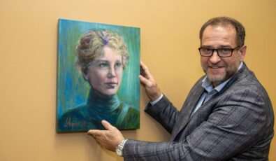 Boris Vulanovic, OPG’s Senior Vice-President of Nuclear Refurbishment, unveils a portrait of Harriet Brooks, which was commissioned as part of the Great Women Portrait Project.