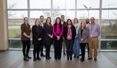 Representatives from OPG, Aecon, Feed the Need Durham, Ontario Shores, and Big Brothers Big Sisters of Clarington gather at OPG's Darlington Energy Complex.